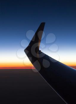 wing aircraft at sunset