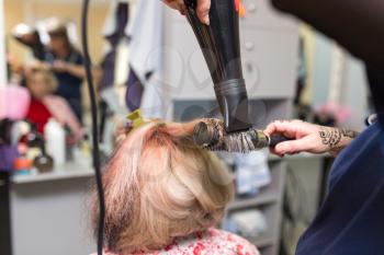 blow-drying in a beauty salon