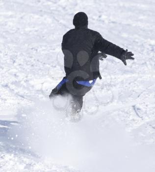 people snowboarding on the snow in the winter