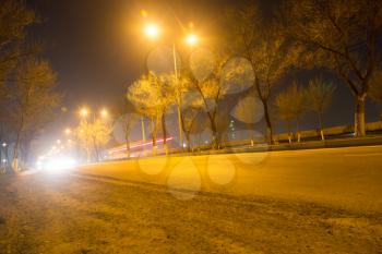road at night with moving cars