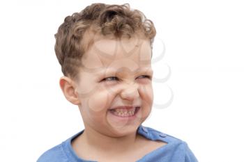 boy showing his teeth on a white background