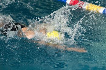 boy goes in for sports in the pool