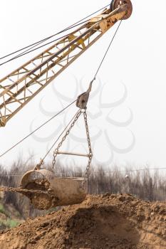 excavator digging a big bucket