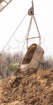 excavator digging a big bucket