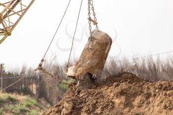 excavator digging a big bucket