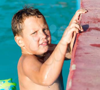 Boy swims in the water park