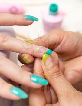 women in a beauty salon manicure