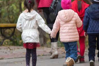 children in the park for a walk