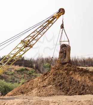 excavator digging a big bucket