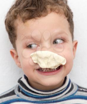 boy with a test on the nose