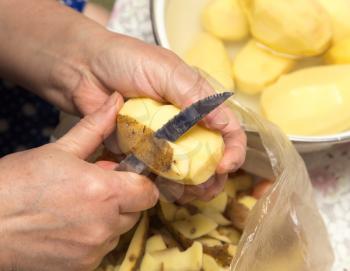 chef peeling potatoes