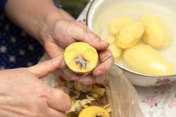 chef peeling potatoes