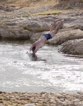 man jumping into water