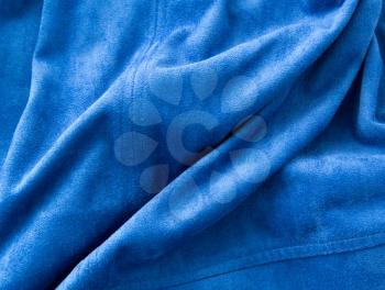 Abstract background of crumpled blue material. texture