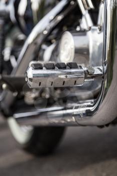 A metal detail on a motorcycle as a background.