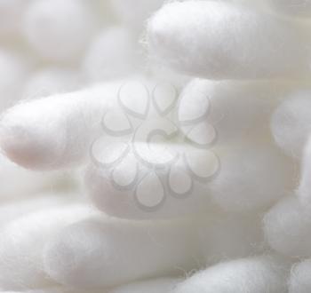 White eared cotton swabs as a background. Macro