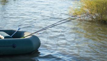 Fishing rods for fishing in a boat on the lake .