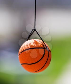 Little ball for the game hanging on the rope .