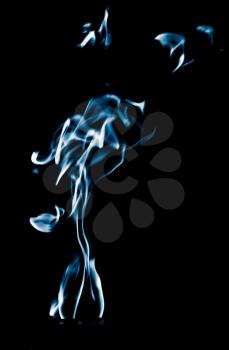 Blue flame of fire on a black background .