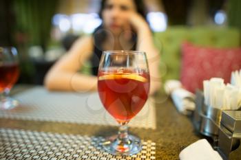 Red strawberry drink on the table in the restaurant .