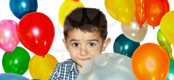 Little boy playing with colorful balloons