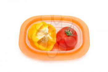 Royalty Free Photo of a Tomato and Pepper in a Container