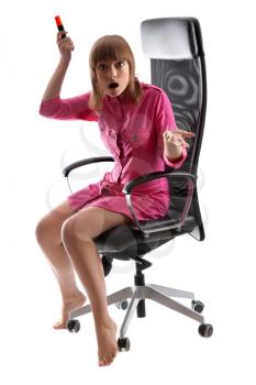 Royalty Free Photo of a Woman Sitting in a Chair
