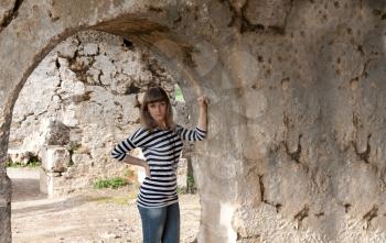 Royalty Free Photo of a Young Woman Posing in Ruins