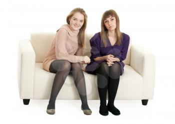 Royalty Free Photo of Two Girls Sitting on a Couch