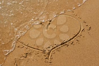 Royalty Free Photo of a Heart in the Sand