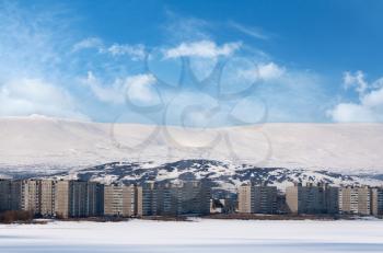 apartment buildings in the mountains in winter