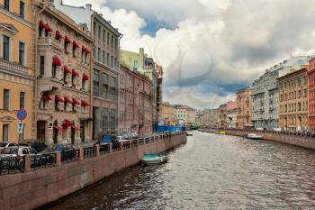 Canal in St. Petersburg against the sky with clouds