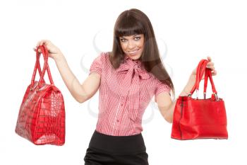 Charming brunette Caucasian girl with two red leather fashion handbags