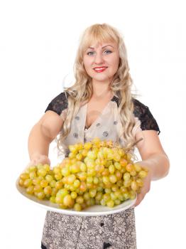 Portrait of attractive young woman holding bowl of grapes. Isolate om white.