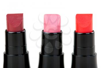 Three lipstick set in a row, isolated on white background