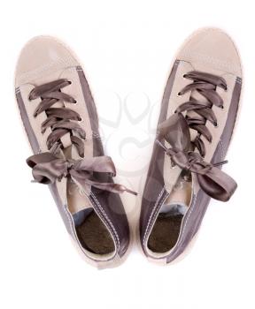 pair of fashionable sneakers on a white background. View from above.