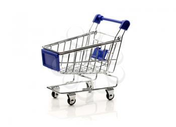 Miniature empty supermarket trolley. Isolate on white background.