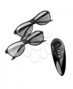 Two pairs of 3D glasses and remote control TV. Isolate on white.