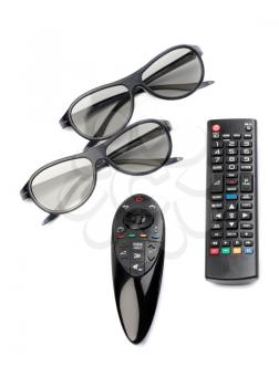 Two pairs of 3D glasses and remote control TV. Isolate on white