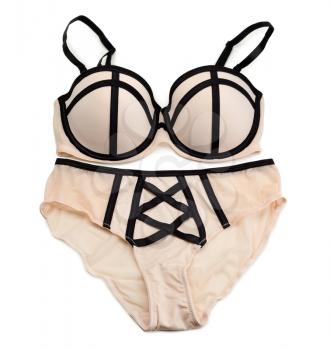 Set of lingerie, beige with black ribbons. Isolate on white.