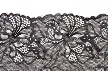 Black fine lace floral texture on white background, soft shadow