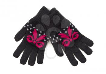 Pair of black knitted gloves with a red pattern. Isolate on white.