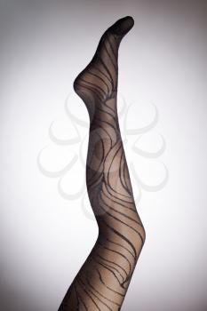 Mannequin female foot in stylish fashion pantyhose
