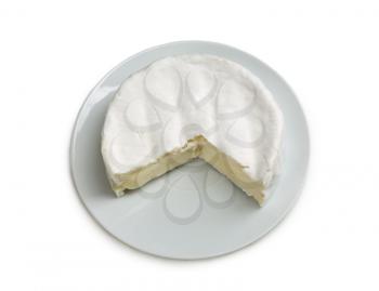 Camembert cheese on a plate. Isolate on white.