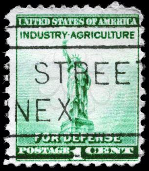Royalty Free Photo of US 1940 Stamps Shows Statue of Liberty, Inscription Industry - Agriculture for Defense