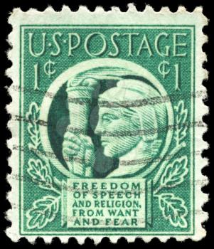 Royalty Free Photo of a 1942 US Stamp Showing Liberty Holding Torch of Freedom & Enlightenment