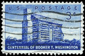 Royalty Free Photo of 1956 US Stamp Shows Log Cabin of Booker T. Washington (1856-1915), Black Educator