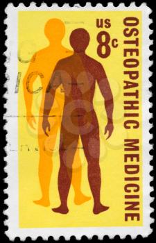 Royalty Free Photo of 1972 US Stamp Shows a Man's Quest for Health, Osteopathic Medicine Issue