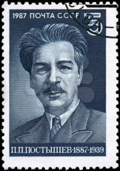 USSR - CIRCA 1987: A Stamp printed in USSR shows the portrait of a Pavel Petrovich Postyshev (1887-1939), party leader, circa 1987