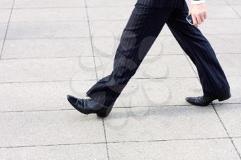 Royalty Free Photo of a Businessman Walking